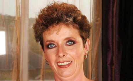 Inviting grannie Babuska exposing big tits and hairy twat 