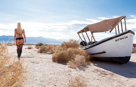 Slender american blonde milf Anikka Albrite showing small tits and hot ass on the beach